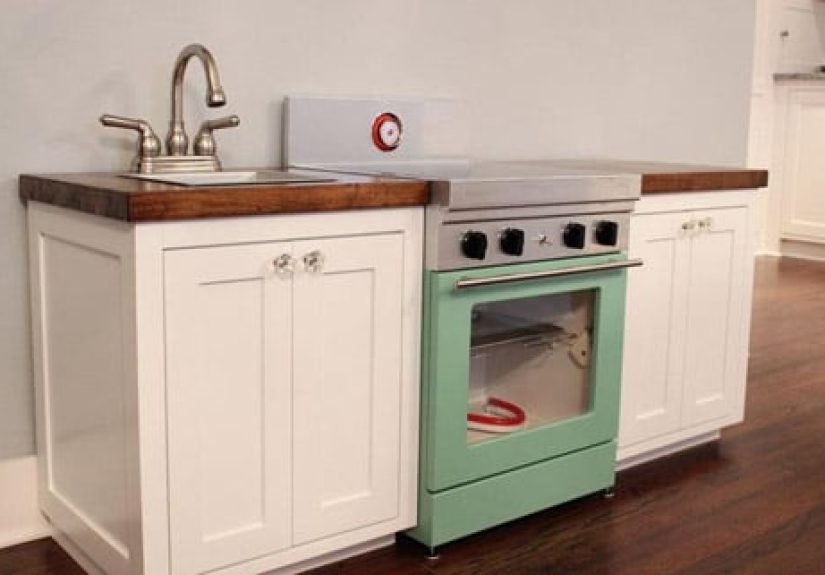 A Cute Play Kitchen With Light-Up Burners