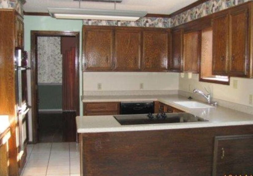 Kitchen Cabinet Refacing: Using Wall Paper!